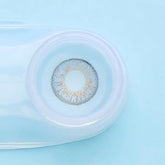 a close up of a blue and white frisbee on a white surface